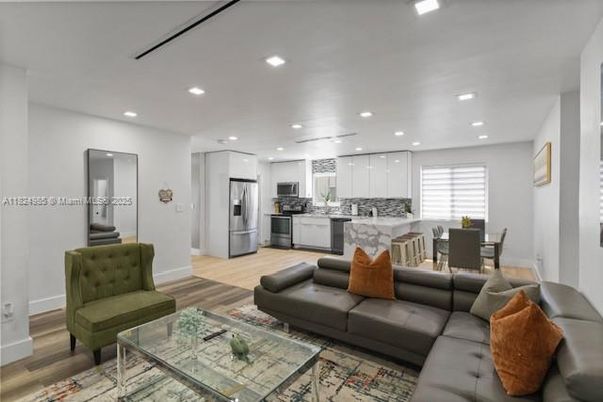 Dining room, Interior, Kitchen, Living room, Recessed Lighting, Stainless Steel Appliances, Wood Texture Flooring