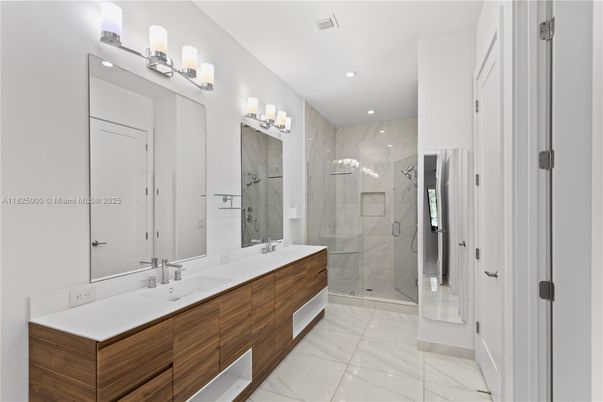 Bathroom, Dual Sink Vanities, Glass Shower, Interior, Marble, Marble Walls, Recessed Lighting