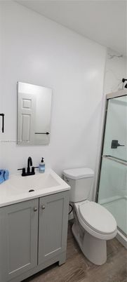Bathroom, Glass Shower, Interior, Marble Walls, Wood Texture Flooring