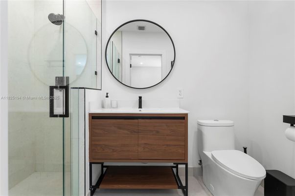 Bathroom, Dual Sink Vanities, Glass Shower, Interior, Wood Texture Flooring