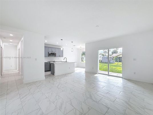 Empty room, Interior, Kitchen, Marble, Pendant Lights, Recessed Lighting, Stainless Steel Appliances