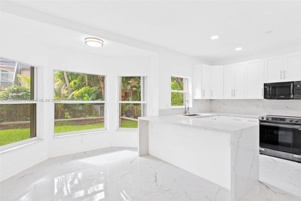 Interior, Kitchen, Marble, Marble Walls, Recessed Lighting, Stainless Steel Appliances