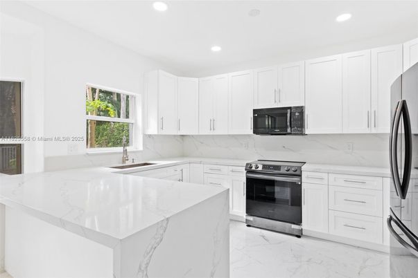 Interior, Kitchen, Marble, Marble Walls, Recessed Lighting, Stainless Steel Appliances