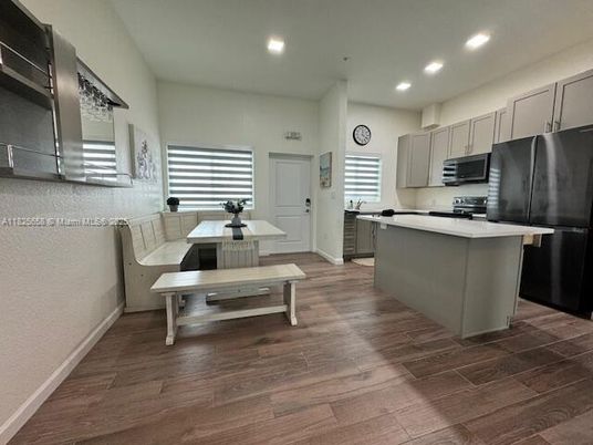 Dining room, Interior, Kitchen, Recessed Lighting, Stainless Steel Appliances, Wood Texture Flooring
