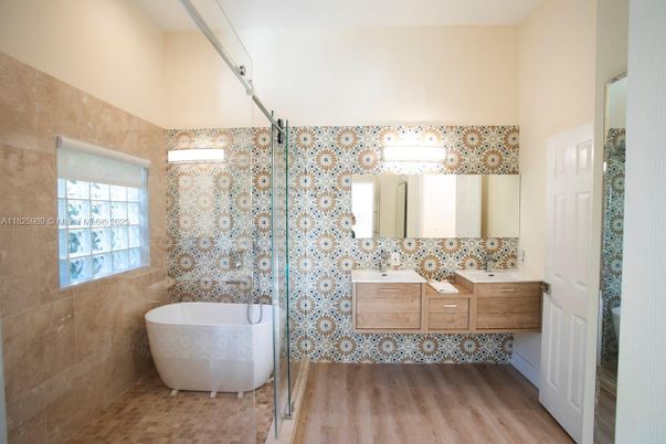 Bathroom, Dual Sink Vanities, Free Standing Baths, Glass Shower, Interior, Wood Texture Flooring