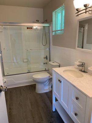 Bathroom, Dual Sink Vanities, Glass Shower, Interior, Wood Texture Flooring