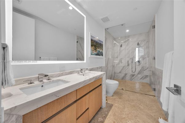 Bathroom, Dual Sink Vanities, Glass Shower, Interior, Marble Walls, Recessed Lighting