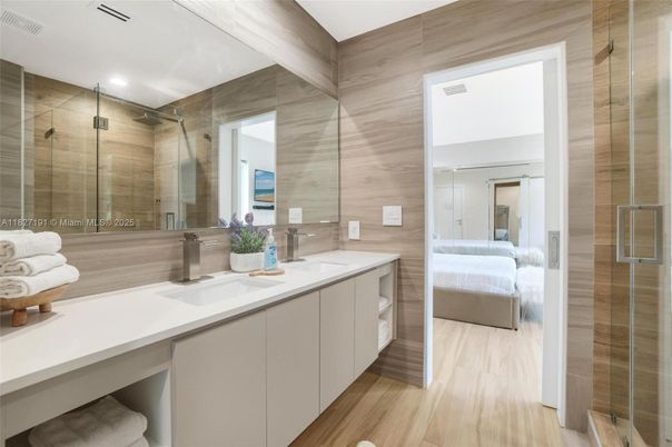 Bathroom, Bedroom, Dual Sink Vanities, Glass Shower, Interior, Recessed Lighting, Wood Texture Flooring