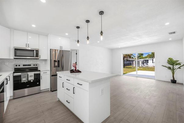 Interior, Kitchen, Pendant Lights, Recessed Lighting, Stainless Steel Appliances, Wood Texture Flooring