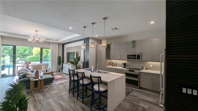 Dining room, Interior, Kitchen, Pendant Lights, Recessed Lighting, Stainless Steel Appliances, Wood Texture Flooring