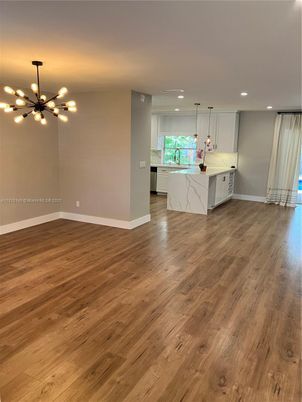 Empty room, Interior, Kitchen, Marble Walls, Pendant Lights, Recessed Lighting, Wood Texture Flooring