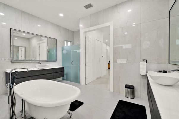 Bathroom, Dual Sink Vanities, Free Standing Baths, Glass Shower, Interior, Marble Walls, Recessed Lighting