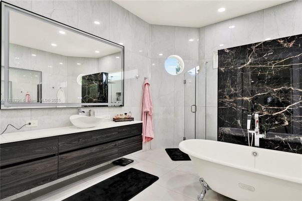 Bathroom, Dual Sink Vanities, Free Standing Baths, Glass Shower, Interior, Marble Walls, Recessed Lighting