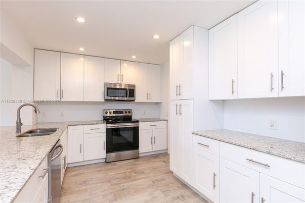 Interior, Kitchen, Recessed Lighting, Stainless Steel Appliances, Wood Texture Flooring