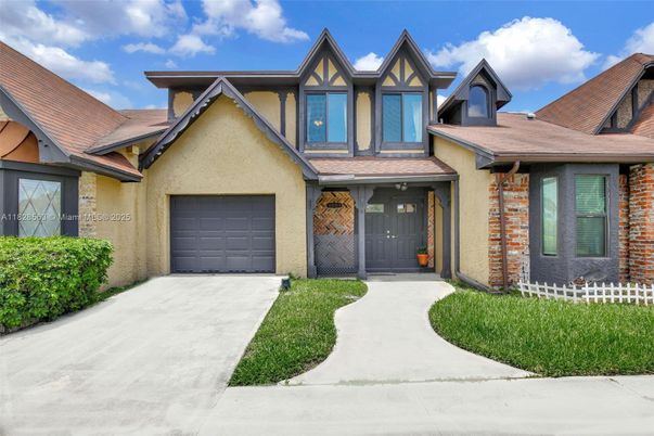 Attached, Exterior, Facade, Tudor Revival
