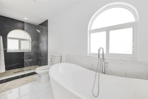 Bathroom, Free Standing Baths, Glass Shower, Interior, Marble, Marble Walls, Recessed Lighting