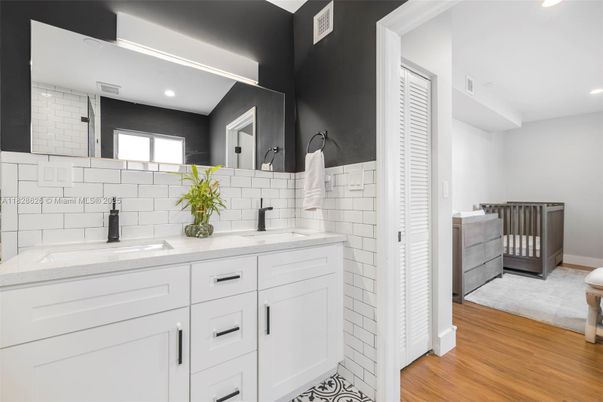 Bathroom, Dual Sink Vanities, Interior, Recessed Lighting, Wood Texture Flooring