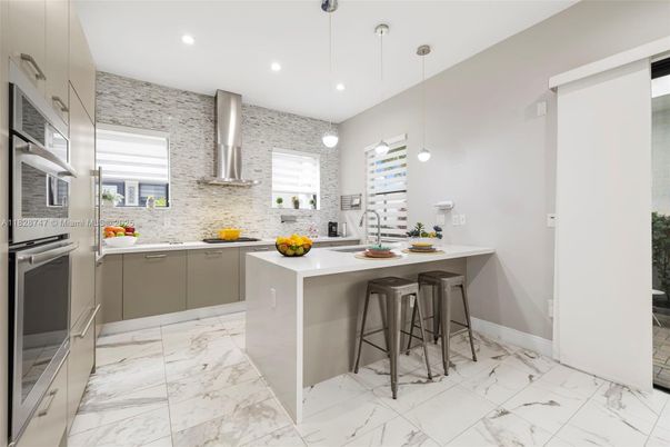 Interior, Kitchen, Marble, Pendant Lights, Recessed Lighting, Stainless Steel Appliances, Stone Walls