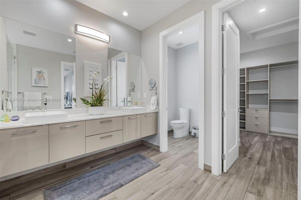 Bathroom, Dual Sink Vanities, Interior, Recessed Lighting, Wood Texture Flooring
