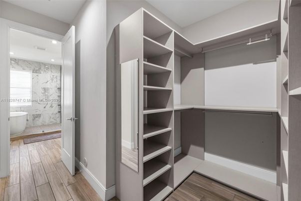 Bathroom, Interior, Marble, Marble Walls, Recessed Lighting, Walk-in Closets, Wood Texture Flooring