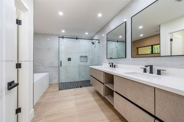 Bathroom, Dual Sink Vanities, Glass Shower, Interior, Marble Walls, Recessed Lighting, Wood Texture Flooring