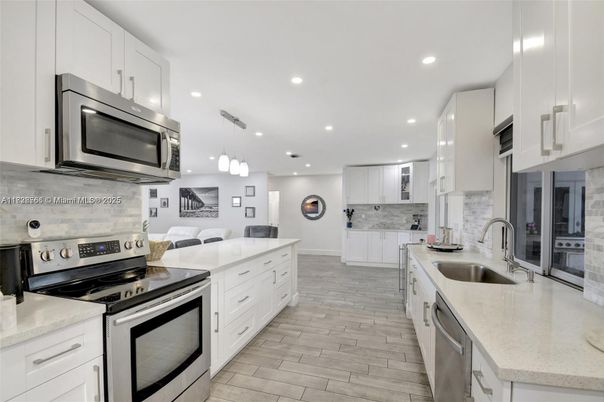 Interior, Kitchen, Pendant Lights, Recessed Lighting, Stainless Steel Appliances, Wood Texture Flooring