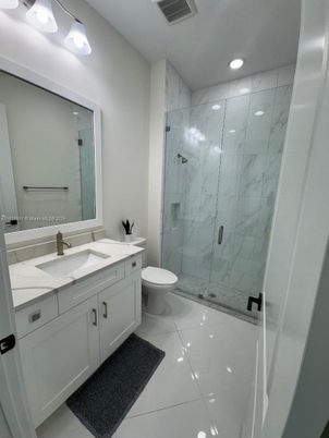 Bathroom, Dual Sink Vanities, Glass Shower, Interior, Marble, Marble Walls, Recessed Lighting