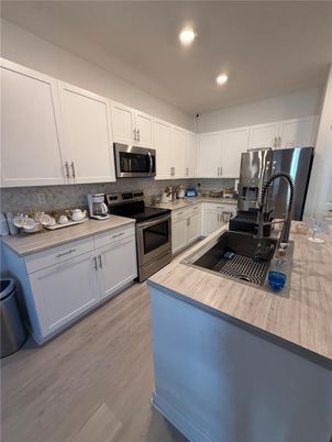 Interior, Kitchen, Recessed Lighting, Stainless Steel Appliances, Wood Texture Flooring
