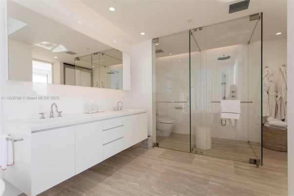 Bathroom, Dual Sink Vanities, Glass Shower, Interior, Recessed Lighting, Wood Texture Flooring