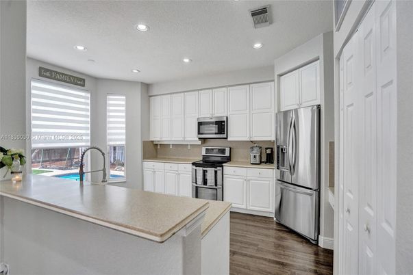 Interior, Kitchen, Recessed Lighting, Stainless Steel Appliances, Wood Texture Flooring