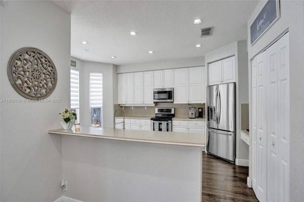 Interior, Kitchen, Recessed Lighting, Stainless Steel Appliances, Wood Texture Flooring
