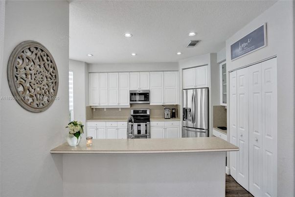 Interior, Kitchen, Recessed Lighting, Stainless Steel Appliances, Wood Texture Flooring