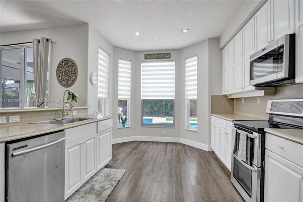 Interior, Kitchen, Recessed Lighting, Stainless Steel Appliances, Wood Texture Flooring