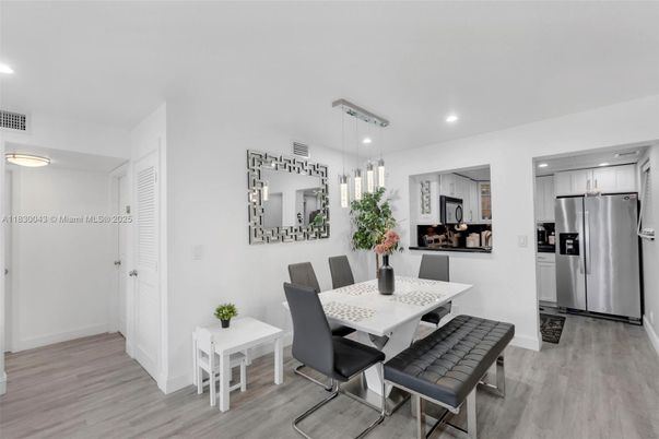Dining room, Interior, Kitchen, Pendant Lights, Recessed Lighting, Stainless Steel Appliances, Wood Texture Flooring