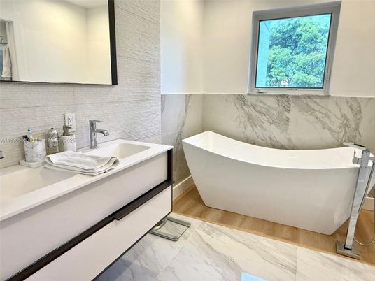 Bathroom, Dual Sink Vanities, Free Standing Baths, Interior, Marble, Marble Walls, Wood Texture Flooring