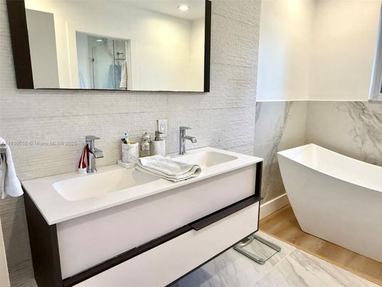 Bathroom, Dual Sink Vanities, Free Standing Baths, Interior, Marble, Recessed Lighting, Wood Texture Flooring