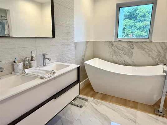 Bathroom, Dual Sink Vanities, Free Standing Baths, Interior, Marble, Marble Walls, Wood Texture Flooring
