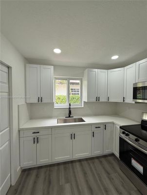 Interior, Kitchen, Recessed Lighting, Stainless Steel Appliances, Wood Texture Flooring