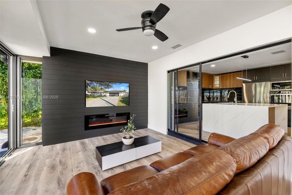 Fireplace, Interior, Kitchen, Living room, Recessed Lighting, Stainless Steel Appliances, Wood Texture Flooring
