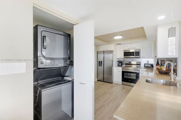 Interior, Kitchen, Recessed Lighting, Stainless Steel Appliances, Washer, Wood Texture Flooring