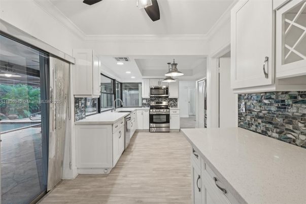 Interior, Kitchen, Pendant Lights, Recessed Lighting, Stainless Steel Appliances, Wood Texture Flooring