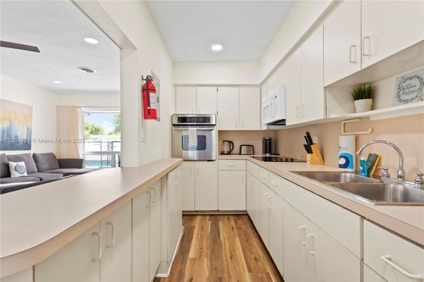 Interior, Kitchen, Recessed Lighting, Stainless Steel Appliances, Wood Texture Flooring