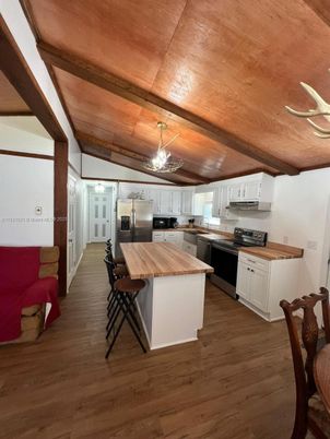 Chandelier, Interior, Kitchen, Stainless Steel Appliances, Wooden Beams, Wooden Ceilings, Wood Texture Flooring
