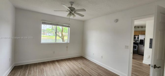Empty room, Interior, Kitchen, Stainless Steel Appliances, Wood Texture Flooring
