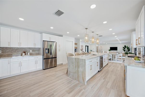 Dining room, Interior, Kitchen, Pendant Lights, Recessed Lighting, Stainless Steel Appliances, Wood Texture Flooring