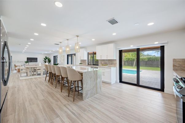 Dining room, Interior, Kitchen, Pendant Lights, Recessed Lighting, Stainless Steel Appliances, Wood Texture Flooring