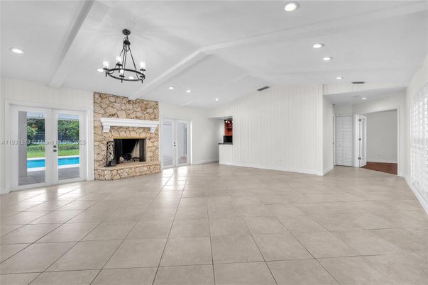 Chandelier, Empty room, Fireplace, Interior, Recessed Lighting, Stone Walls