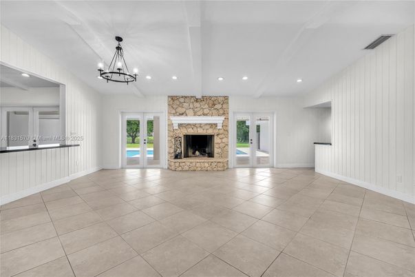 Chandelier, Empty room, Fireplace, Interior, Recessed Lighting, Stone Walls