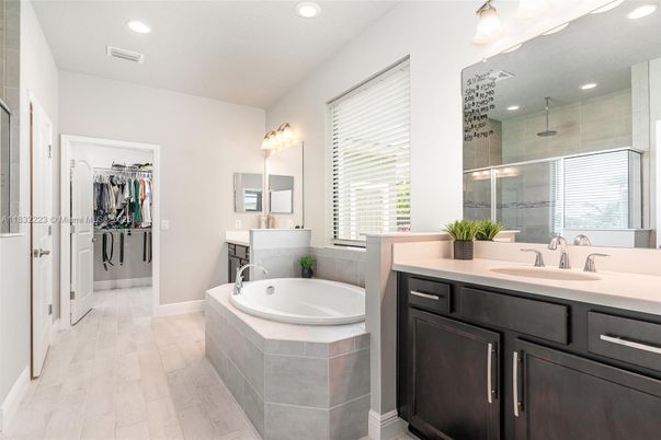 Bathroom, Dual Sink Vanities, Glass Shower, Interior, Recessed Lighting, Wood Texture Flooring