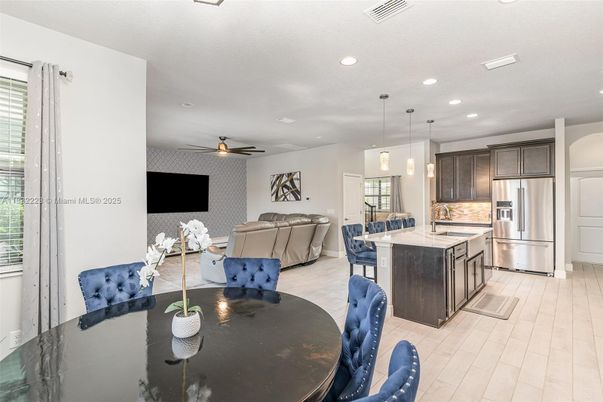 Dining room, Interior, Kitchen, Living room, Pendant Lights, Recessed Lighting, Stainless Steel Appliances, Wood Texture Flooring
